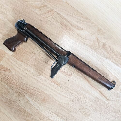 BM59Alpini7 - MAF Corp. Partially visible rifle with wooden stock resting on a light wooden floor on a diagonal.