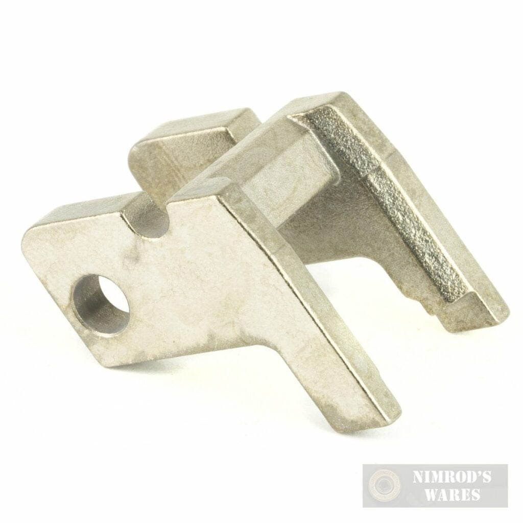 Silver metal machined bracket with a circular hole, featuring forked prongs and a slot for alignment.